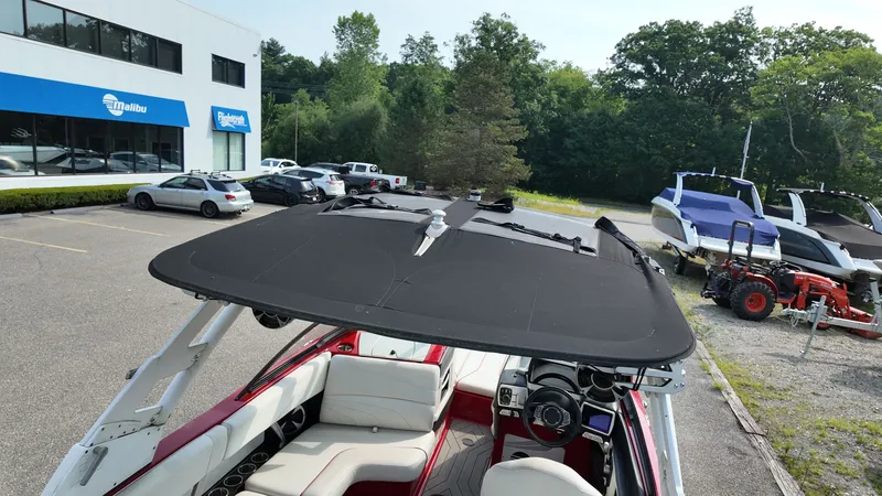 Slide: The Image of 2017 Malibu Wakesetter 24 MXZ boat parked outdoors. - 6