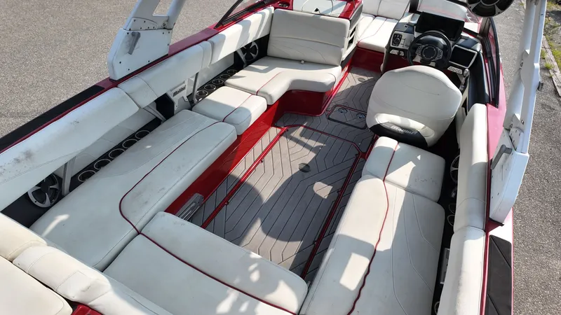 Slide: The Image of Interior of a 2017 Malibu Wakesetter 24 MXZ boat with white seating. - 9