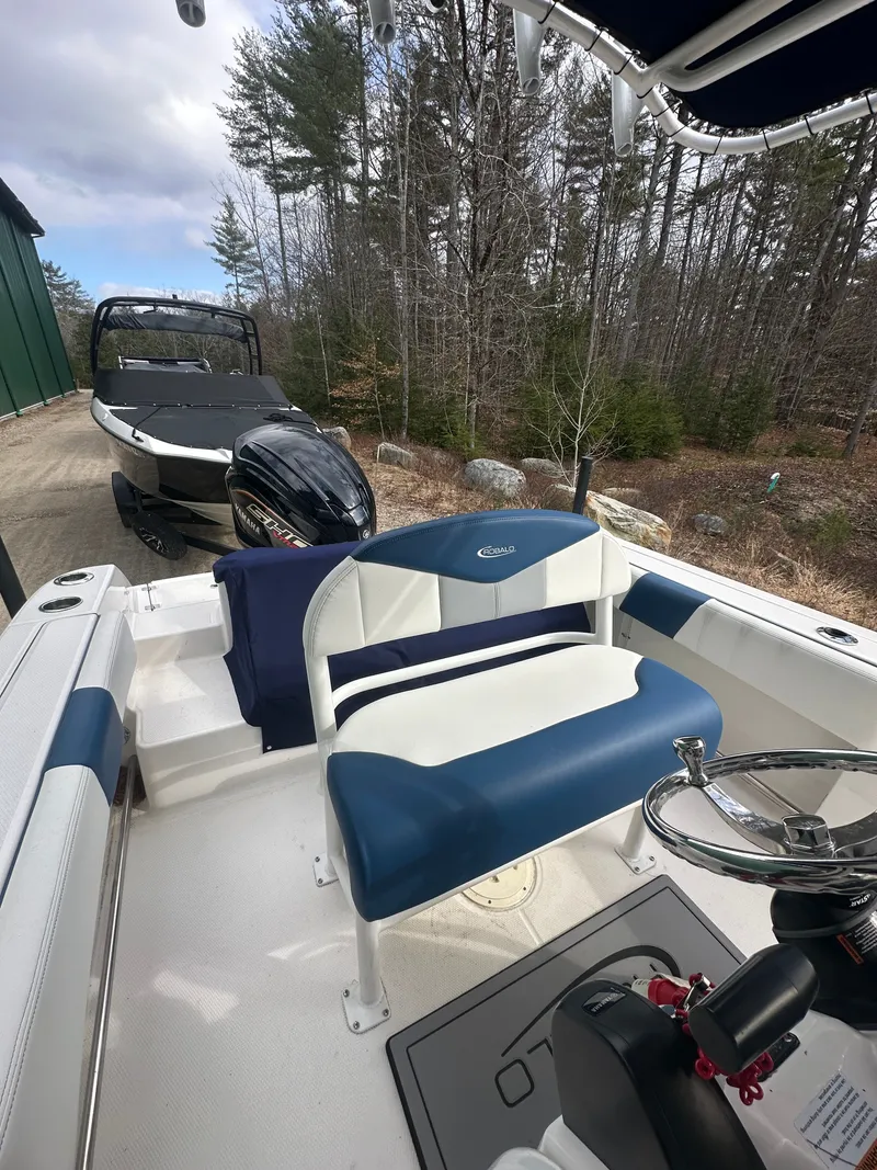 Slide: The Image of Interior view of 2023 Robalo R202 Explorer boat outdoors. - 10