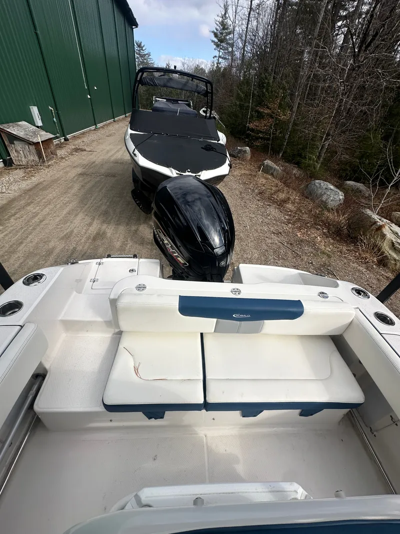 Slide: The Image of 2023 Robalo R202 Explorer boat parked on a forest path. - 11