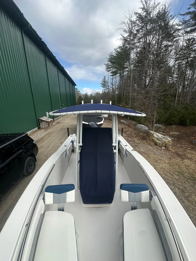 Slide: The Image of 2023 Robalo R202 Explorer boat on a forest path. - 7