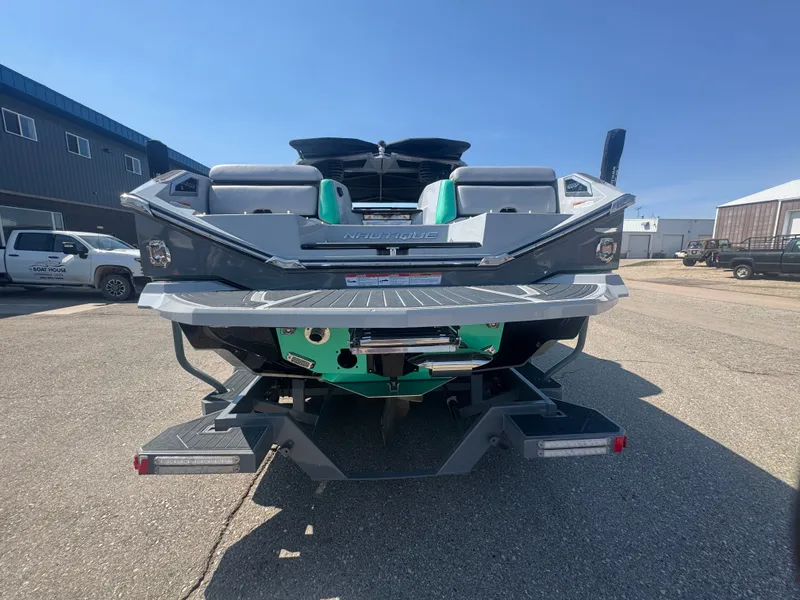 Slide: The Image of Rear view of a 2021 Nautique Super Air Nautique G25 Paragon boat. - 6