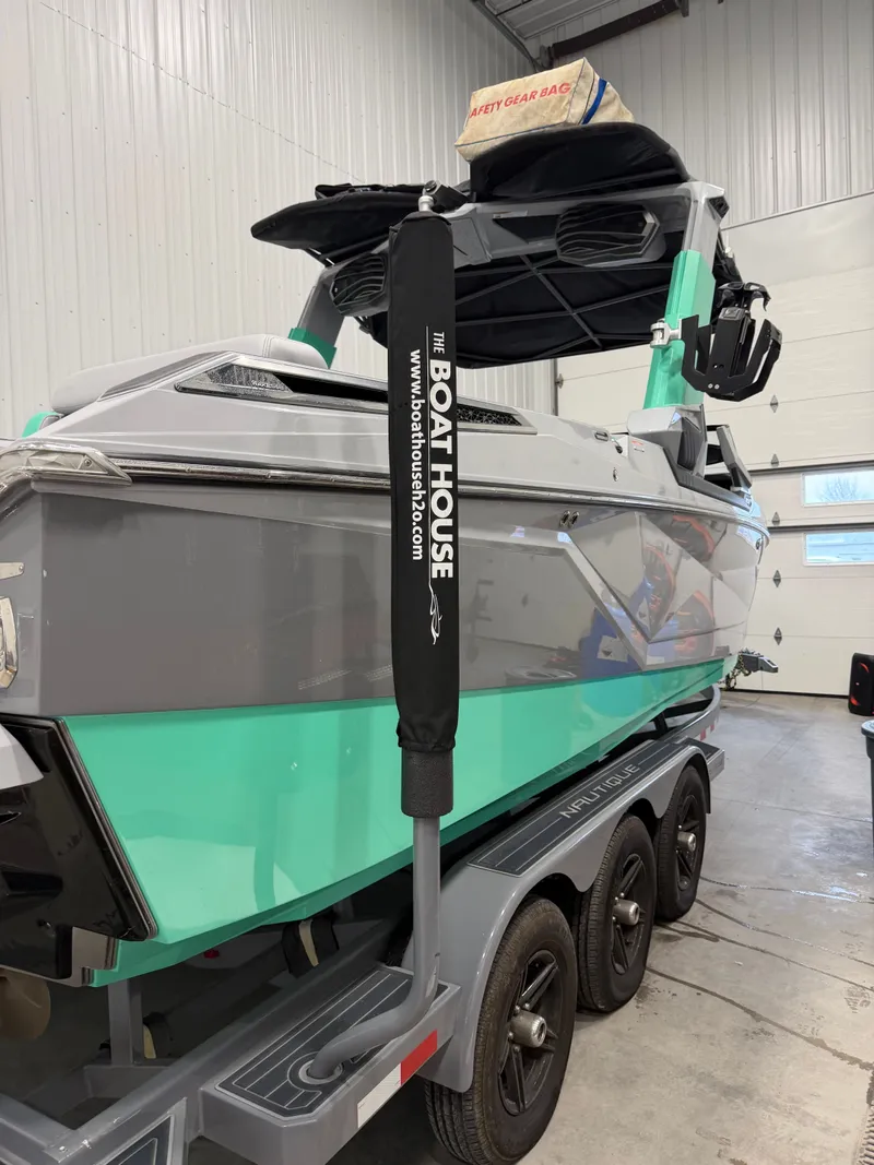 Slide: The Image of 2021 Nautique Super Air Nautique G25 Paragon in a garage. - 7