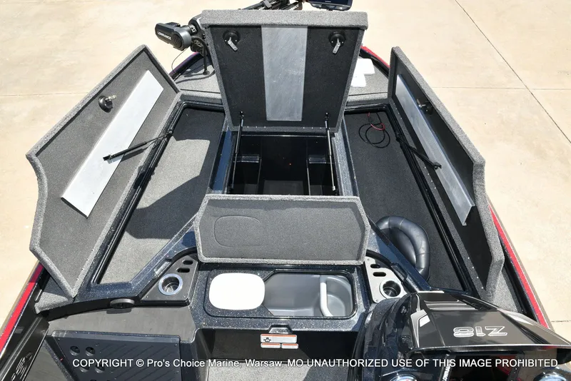 Slide: The Image of 2023 Nitro Z18 Pro boat with open storage compartments and engine. - 10