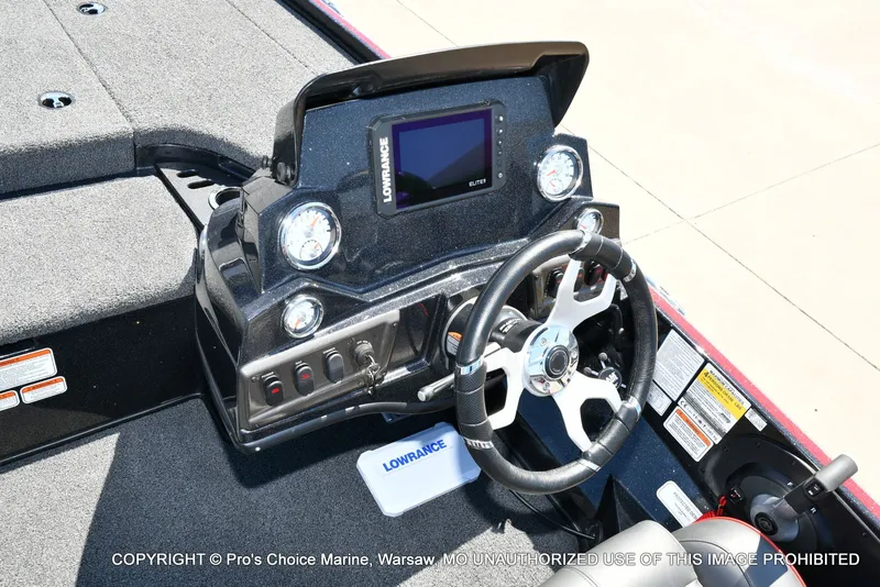 Slide: The Image of Dashboard of Nitro Z18 Pro boat with steering wheel and Lowrance display. - 46