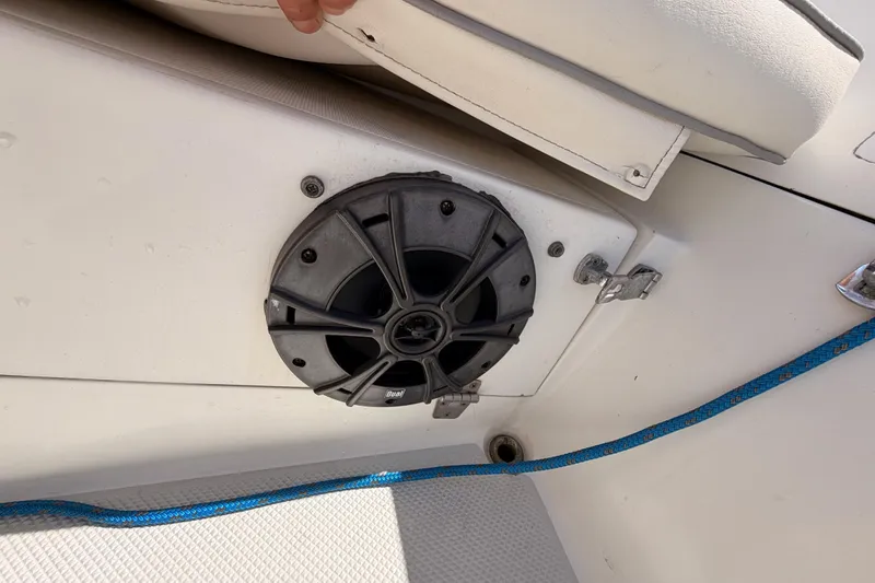 Slide: The Image of Speaker installation on a 1999 Catalina 320 boat, featuring a blue rope and white seating. - 20