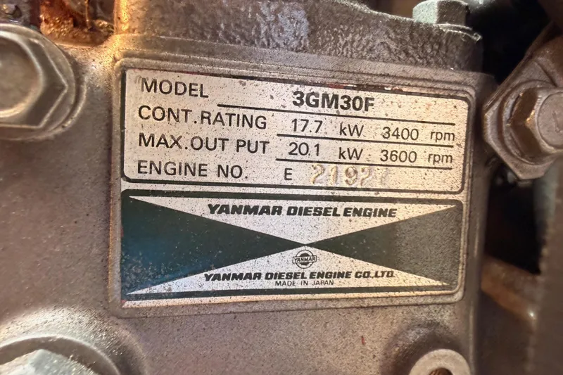 Slide: The Image of Yanmar 3GM30F diesel engine label, showing power ratings and engine number for Catalina 320, 1999. - 53