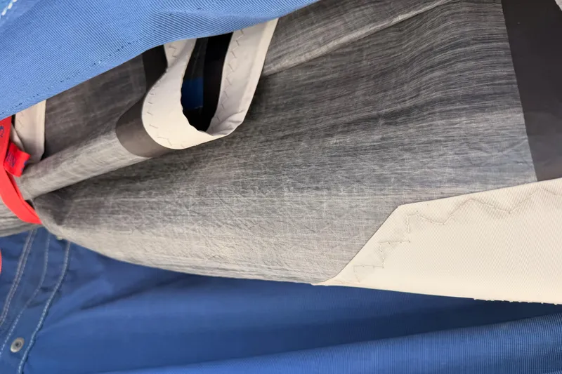 Slide: The Image of Close-up of Catalina 320 sailboat sail, showcasing fabric texture and stitching details. - 57