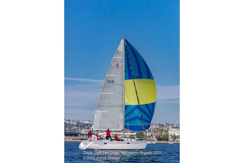 Slide: The Image of Sailboat Catalina 320 (1999) with colorful spinnaker at San Diego Regatta 2021. - 62