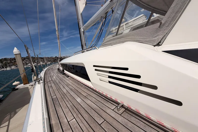 Slide: The Image of 2020 Beneteau Oceanis 51.1 yacht with sleek design and wooden deck, docked at marina. - 10