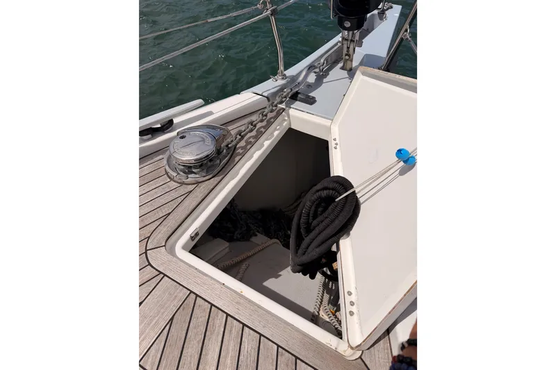 Slide: The Image of Anchor locker of 2020 Beneteau Oceanis 51.1 sailboat with ropes and chain. - 15