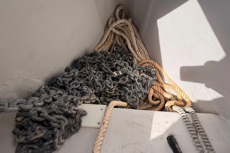 Slide: The Image of Anchor chain and ropes in a 2020 Beneteau Oceanis 51.1 sailboat compartment. - 16