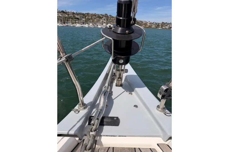 Slide: The Image of Bow of 2020 Beneteau Oceanis 51.1 sailboat with anchor chain and marina view. - 18