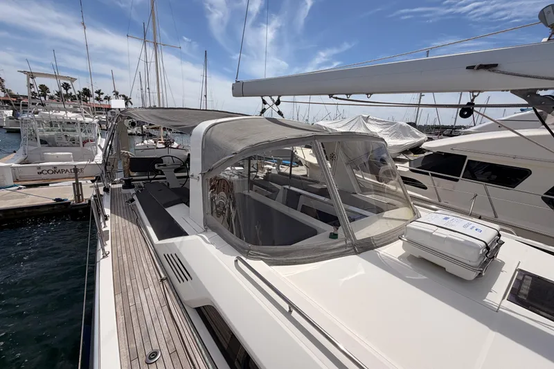 Slide: The Image of Beneteau Oceanis 51.1 yacht, 2020 model, docked at marina under clear sky. - 24