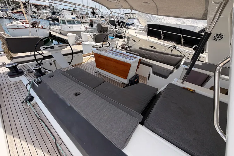 Slide: The Image of Spacious deck of 2020 Beneteau Oceanis 51.1 yacht with comfortable seating and steering wheel. - 25