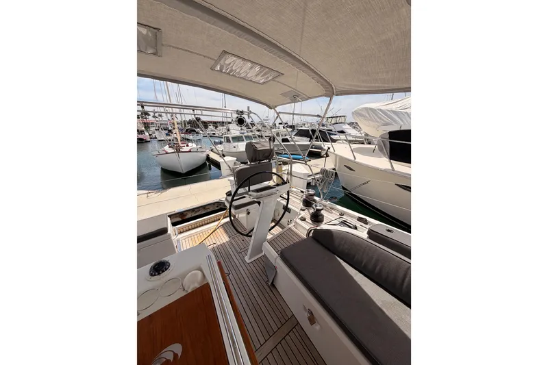 Slide: The Image of Cockpit view of 2020 Beneteau Oceanis 51.1 yacht docked at marina. - 28