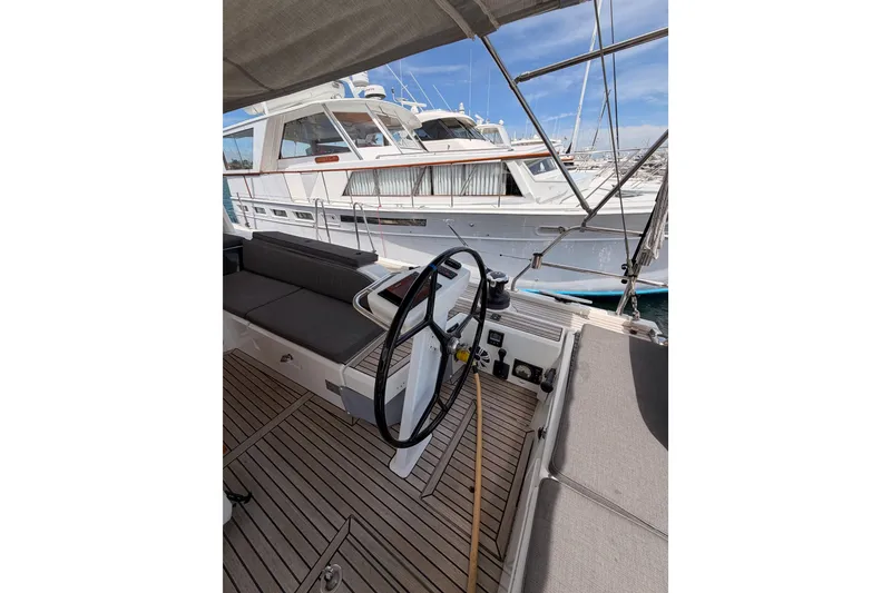 Slide: The Image of Cockpit view of 2020 Beneteau Oceanis 51.1 yacht with steering wheel and seating. - 36