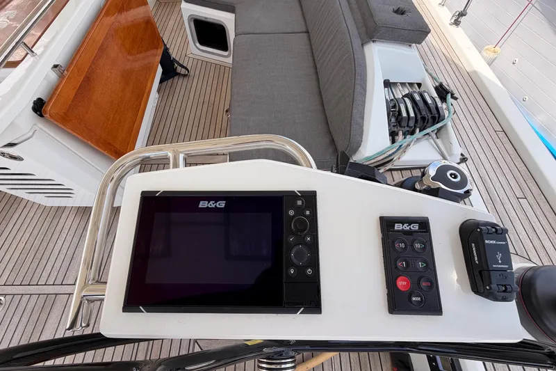 Slide: The Image of Cockpit of 2020 Beneteau Oceanis 51.1 yacht with navigation controls and seating. - 37