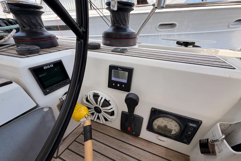 Slide: The Image of Cockpit controls of a 2020 Beneteau Oceanis 51.1 sailboat with navigation instruments. - 38
