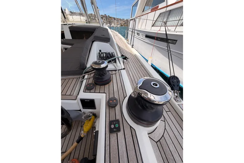 Slide: The Image of Deck view of 2020 Beneteau Oceanis 51.1 sailboat with winches and teak finish. - 39