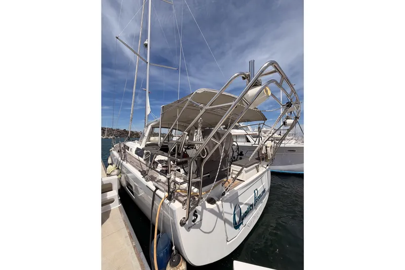 Slide: The Image of 2020 Beneteau Oceanis 51.1 yacht docked at marina under clear blue sky. - 4