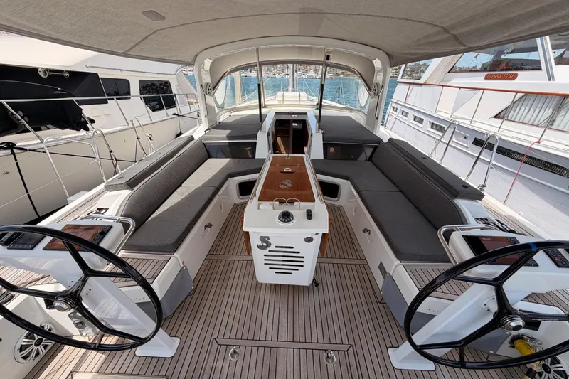 Slide: The Image of Cockpit of 2020 Beneteau Oceanis 51.1 yacht with dual steering wheels and spacious seating. - 40
