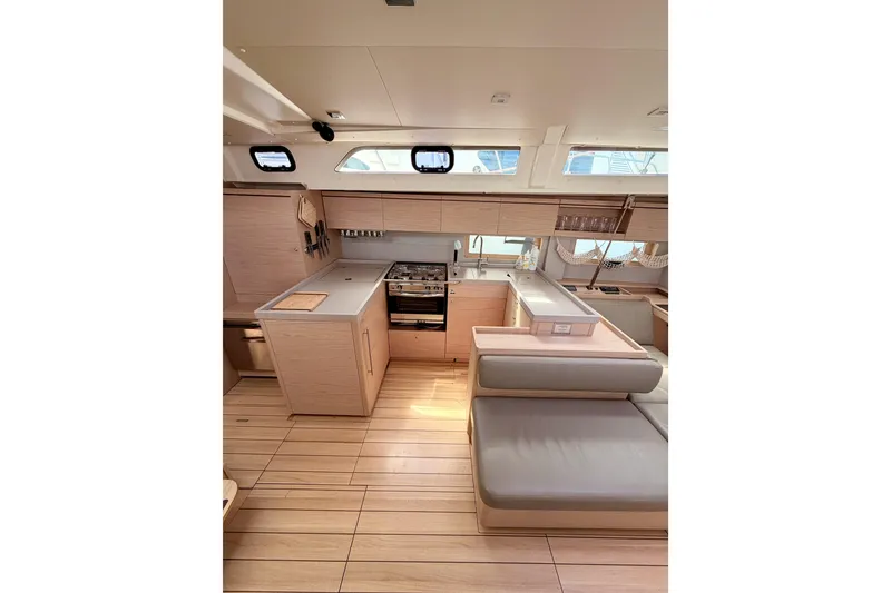 Slide: The Image of Modern kitchen interior of 2020 Beneteau Oceanis 51.1 yacht with sleek wood finish. - 47