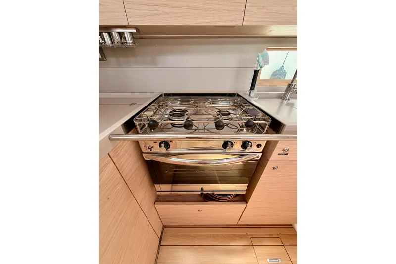 Slide: The Image of Modern kitchen in 2020 Beneteau Oceanis 51.1 yacht with stainless steel stove. - 49