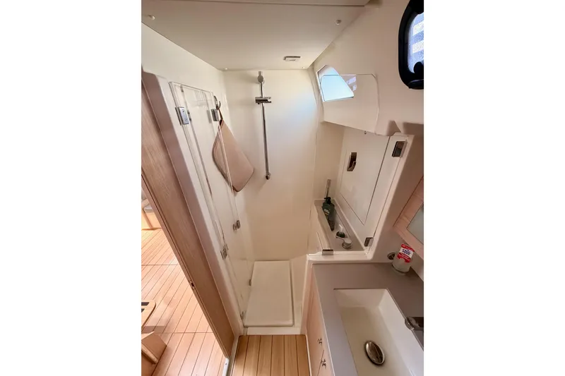 Slide: The Image of Modern bathroom interior of 2020 Beneteau Oceanis 51.1 yacht with shower and sink. - 58