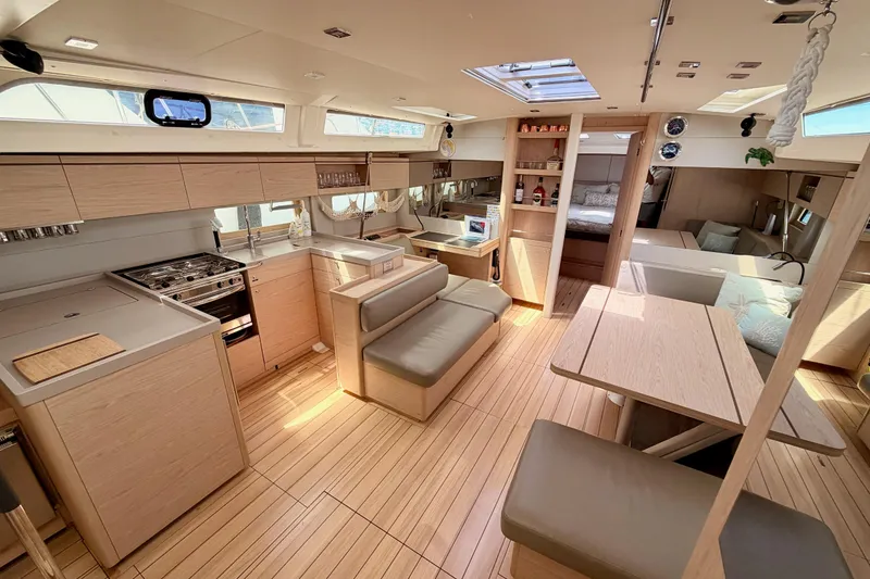 Slide: The Image of Luxurious interior of 2020 Beneteau Oceanis 51.1 yacht with modern kitchen and seating area. - 63