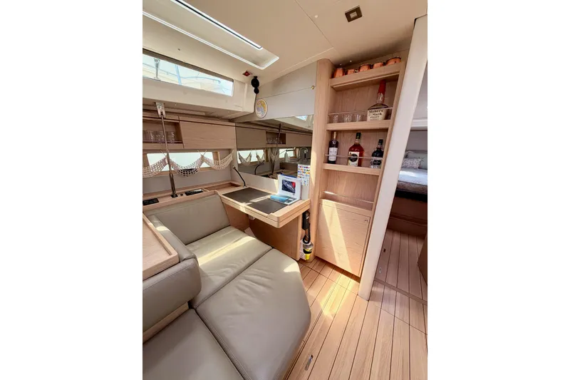 Slide: The Image of Luxurious interior of 2020 Beneteau Oceanis 51.1 yacht with elegant seating and wooden cabinetry. - 65