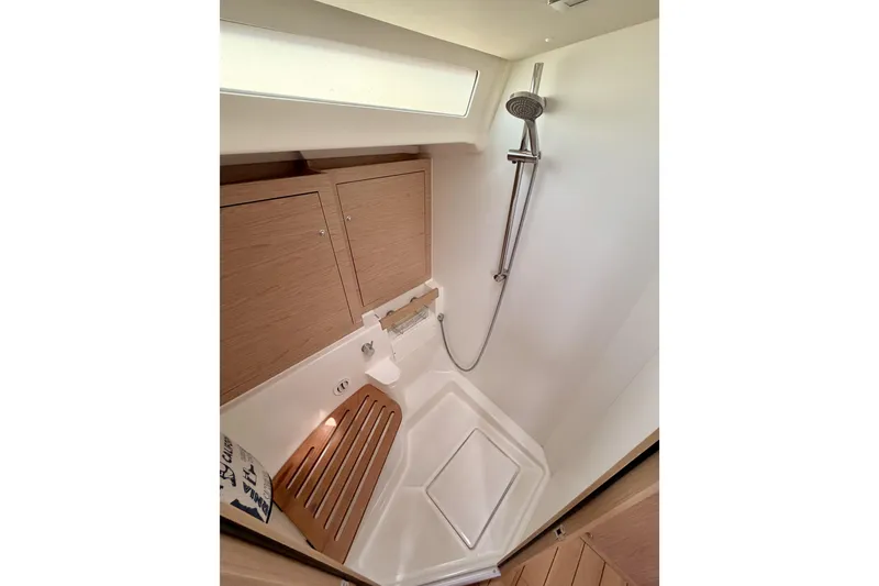 Slide: The Image of Shower area in 2020 Beneteau Oceanis 51.1 yacht with wooden accents and modern fixtures. - 77