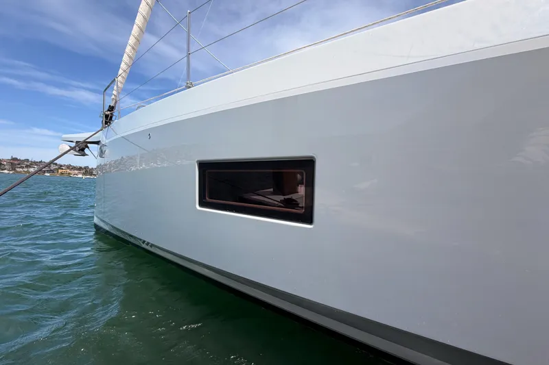 Slide: The Image of 2020 Beneteau Oceanis 51.1 yacht on water, showcasing sleek hull design. - 8