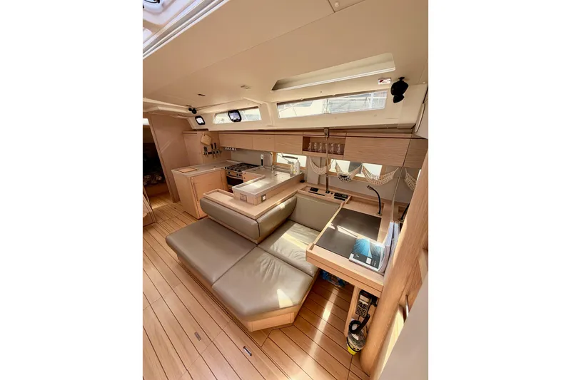 Slide: The Image of Interior of 2020 Beneteau Oceanis 51.1 yacht, featuring modern kitchen and seating area. - 81