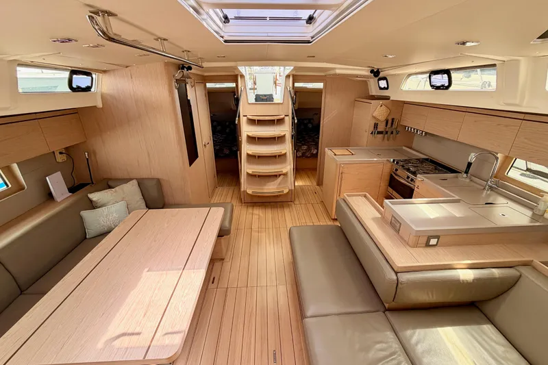 Slide: The Image of Luxurious interior of 2020 Beneteau Oceanis 51.1 yacht with modern kitchen and seating area. - 82