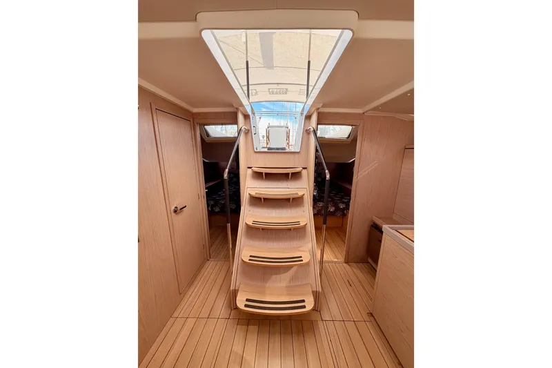 Slide: The Image of Interior of 2020 Beneteau Oceanis 51.1 yacht with wooden stairs and modern design. - 83