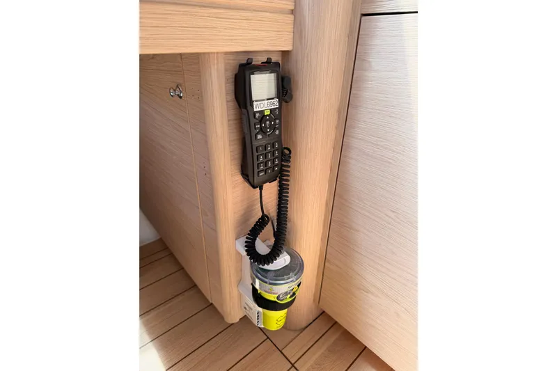 Slide: The Image of VHF radio mounted on a 2020 Beneteau Oceanis 51.1 yacht interior. - 84