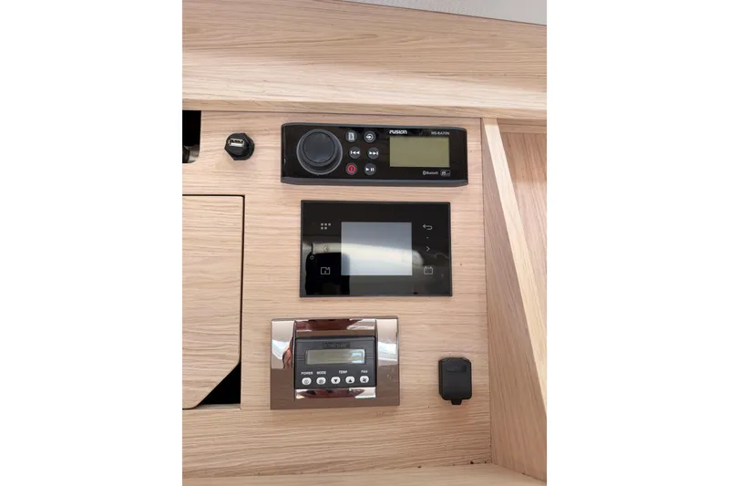 Slide: The Image of Control panel of a 2020 Beneteau Oceanis 51.1 yacht with modern navigation equipment. - 86