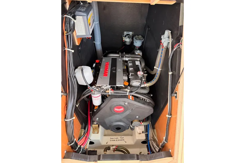 Slide: The Image of Engine compartment of a 2020 Beneteau Oceanis 51.1 sailboat, featuring a Yanmar engine. - 89