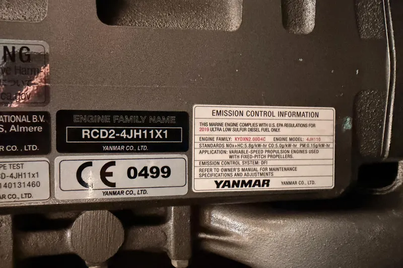 Slide: The Image of Yanmar engine emission control label on a 2020 Beneteau Oceanis 51.1 sailboat. - 90