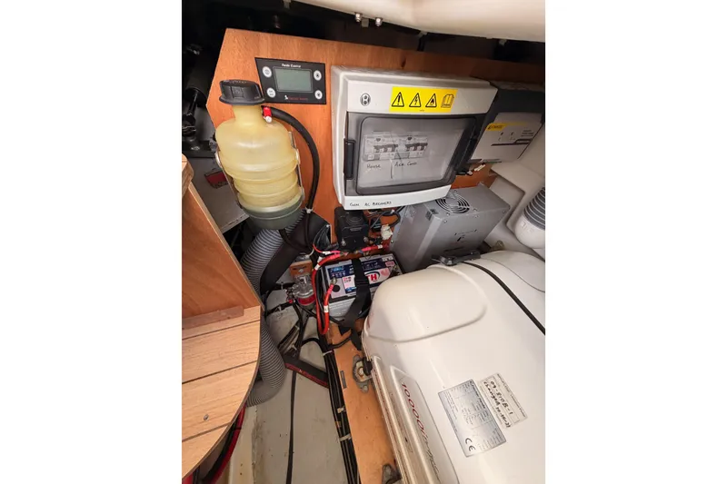 Slide: The Image of Engine compartment of a 2020 Beneteau Oceanis 51.1 sailboat, showcasing electrical components. - 94