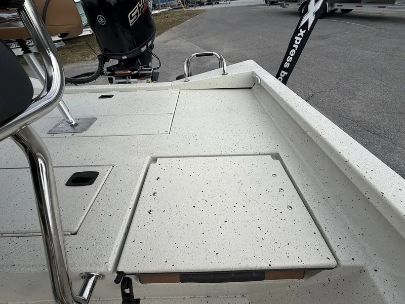 Slide: The Image of 2026 Xpress Hyper-Lift Bay Series boat deck with motor view. - 12