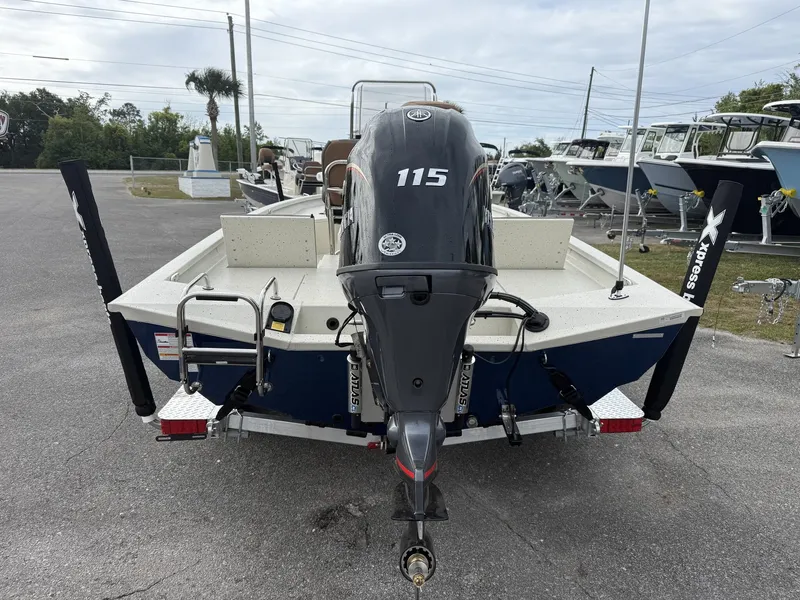 Slide: The Image of 2026 Xpress Hyper-Lift Bay Series boat with outboard motor. - 5