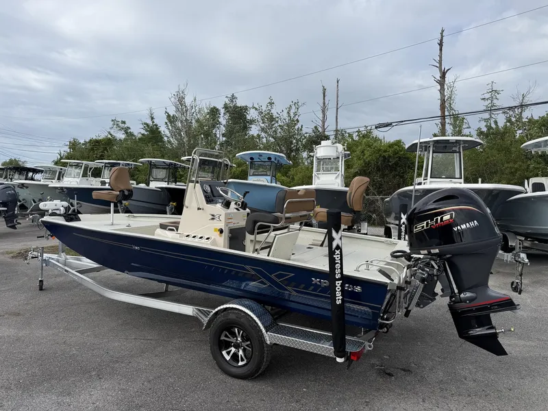 Slide: The Image of 2026 Xpress Hyper-Lift Bay Series boat on trailer. - 6