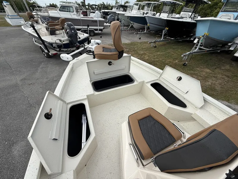 Slide: The Image of Xpress Hyper-Lift Bay Series 2026 with open storage compartments and seats. - 8