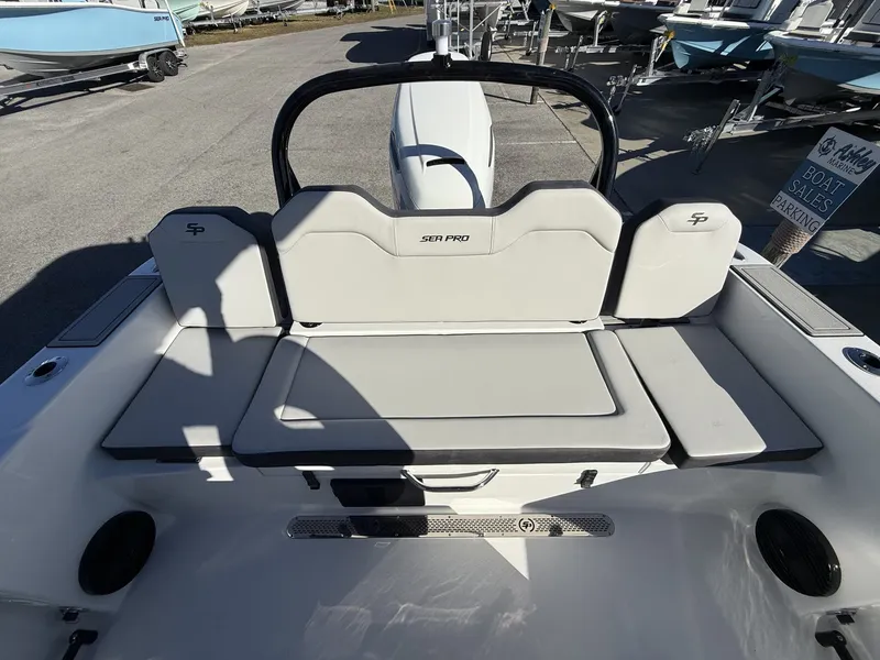 Slide: The Image of Rear view of 2026 Sea Pro 245FLX with cushioned seating. - 13