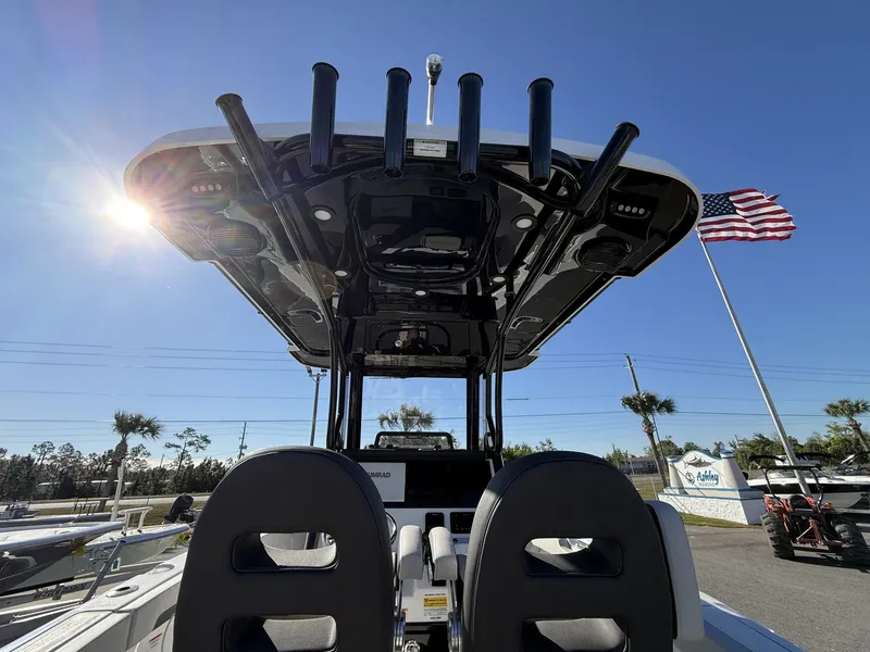 Slide: The Image of 2026 Sea Pro 245FLX boat with sun canopy and American flag. - 15