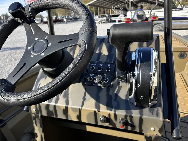Slide: The Image of Steering wheel and controls of Gator Tail Extreme Series 1860 boat, 2026 model. - 11