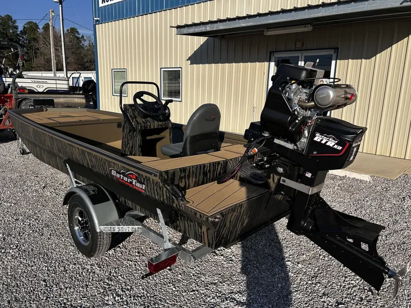 Slide: The Image of Gator Tail Extreme Series 1860 boat, 2026 model, on trailer outside building. - 5