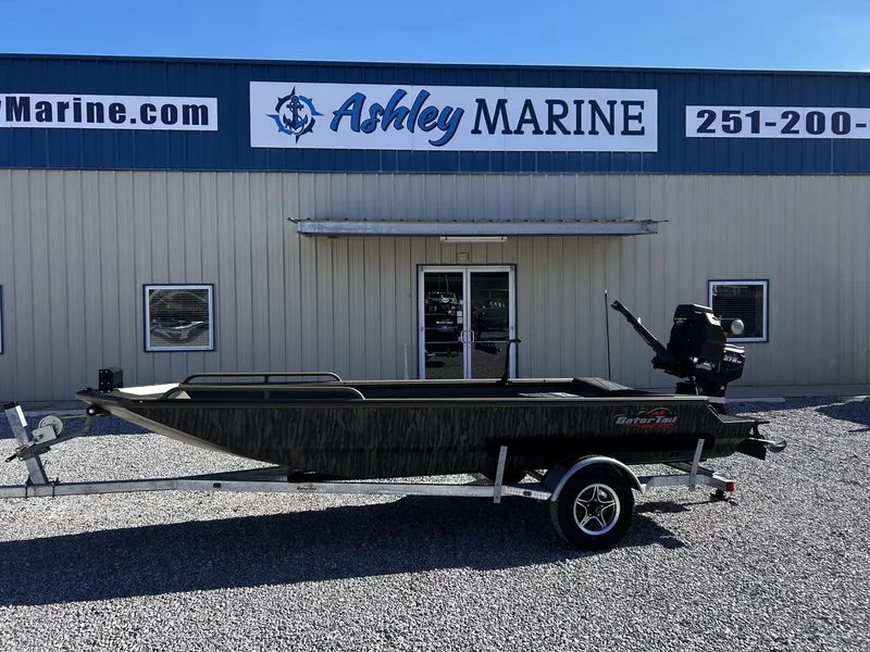 The Image of Gator Tail Savage Series 1750 boat outside Ashley Marine store. - 1